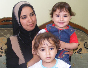 Hadeel al-Bardawil and her children. Photo: Muhammad Sabah, B'Tselem, 28 July 2008.
