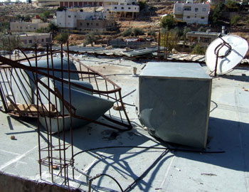 Damaged property on the family's roof after the assault. Photo: 'Isa Amro, B'Tselem, 12 Dec. 2008.