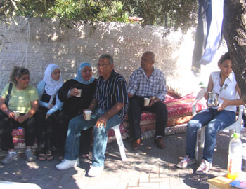 Several of the Hanun family members in the street. Photo: Kareem Jubran, B'Tselem, 5 Aug. '09. 
