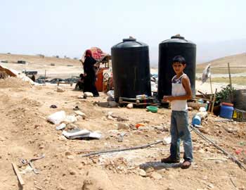 Water tanks of the Dagharmeh family in al-Farsiya. Photo: ‘Atef Abu a-Rub, B'Tselem, 10 August 2010.