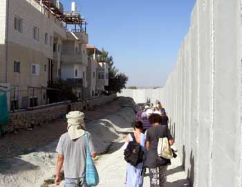 The separation wall next to houses in the village. Photo: Eyal Hareuveni, B'Tselem, 5 November 2010.