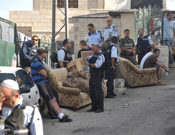 Police evict Qara'in family from their home in Jabal Mukabber. Photo: Wadi Hilweh Information Center, 23 Nov. 10.