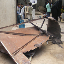 The iron gate that was blown onto the Abu Me'tiq family while they were sitting in the yard of their home in Beit Hanun, apparently causing their death. Photo: Muhammad Sabah, B'Tselem, 28.4.08.