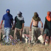 The four assailants moments before the attack. Photo: Muna a-Nawaj'ah, Camera distribution project,  B'Tselem, 8 June '08