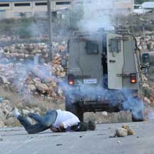 Mustafa Tamimi, immediately after he was shot. Photo: Haim Scwarczenberg, 9 Dec. '11.
