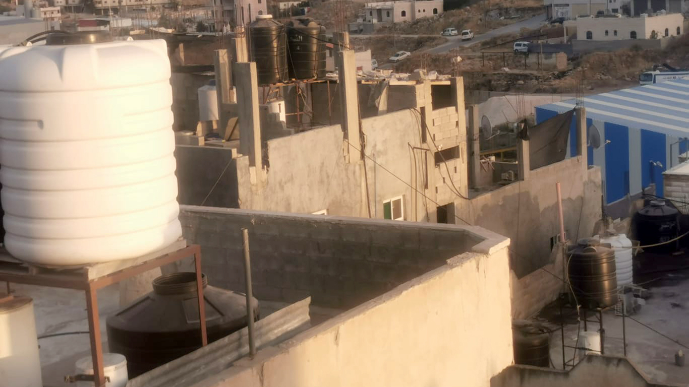 View from the roof on which Hussein Titi was killed to the roof the soldiers were standing on. Photo by Nasser Nawaj'ah, B’Tselem