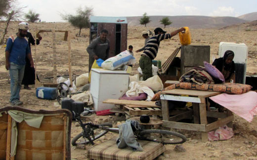 Family after their home was demolished in Fasayil, Jordan Valley. Photo: 'Atef Abu a-Rub, B'Tselem, 14 June '11.