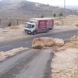 <p>[] 10  An entrance to Abu Ghassan neighborhood in the village of Khirbet a-Deir in the West Bank blocked by the army in February 2011.</p><p>Photo credit: Suha Zeid, B'Tselem</p>