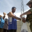 <p>[1316] 11  An Israeli soldier handcuffs Palestinian men after rounding up all males age 14-40 in the Deheisha refugee camp, near Bethlehem, during Operation Defensive Shield.</p><p>Photo credit: Ammar Awad, © Reuters</p>