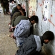 <p>[1311] 31  Arrested Palestinians being guarded by IDF soldiers during Operation Defensive Shield.</p><p>Photo credit: Osama Silwadi, © Reuters</p>