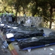 <p>[6645] 21  The covered bodies of victims of a suicide bombing, lined up at the side of the road. A Palestinian suicide bomber killed 11 people on November 21, 2002 when he blew himself up on a crowded bus during the morning rush hour in Jerusalem.</p><p>Photo credit: Gil Cohen Magen, © Reuters</p>