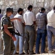 <p>[4886] 7  Palestinian workers on their way home from work held by border police at the Gilo checkpoint while their IDs are checked.</p><p>Photo credit: Magnus Johansson, © Reuters</p>