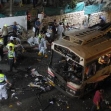 <p>[6644] 19  Israeli rescue workers recover bodies from the wreckage of a destroyed bus following an explosion in Jerusalem on August 19, 2003. A Palestinian suicide bombing blew apart a bus, killing 23 people and wounding about 80.</p><p>Photo credit: Haim Zach, © Reuters</p>