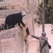 <p>[1760] 11  Female university students head home from classes, by way of Israel's Separation Barrier that cuts through their town of Abu Dis, adjacent to Jerusalem.</p><p>Photo credit: Brian Duss</p>