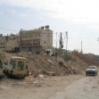 <p>[2803] 28  Children stand on the roadblock at the only entrance to Sheikh Sa'id, adjacent to East Jerusalem, preventing vehicles from entering and leaving the village. The Separation Barrier is now planned to run along this road, in effect sealing off the village.</p><p>Photo credit: Checkpoint Monitors Team, B'Tselem</p>