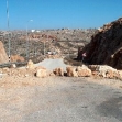 <p>[2958] 10  Rocks placed along a road by the IDF to serve as a physical roadblock preventing passage for Palestinian vehicles.</p><p>Photo credit: Eliezer Moav, B'Tselem</p>