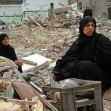 <p>[4419] 15  Palestinian women sit on the rubble of their house after it was demolished by Israeli bulldozers during IDF Operation Rainbow in Rafah, in the Gaza Strip in May 2004.</p><p>Photo credit: Ibraheem Abu Mustafa, © Reuters</p>