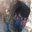 <p>[6654] 13  Children at the opening of a cave used as a residence in Khirbet a-Tuba, in South Mt. Hebron. The IDF is attempting to evacuate the caves' residents from their villages.</p><p>Photo credit: Musa Abu Hashhash, B'Tselem</p>
