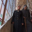 <p>[6867] 8  Raja'a Abu 'Ayesha, age 17, and her father at the entrance to their fortified house in Hebron, around which the Jewish settlement of Tel Rumeida was built. The members of the family are regularly subjected to  attacks by settlers.</p><p>Photo credit: Musa Abu Hashhash, B'Tselem</p>