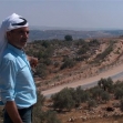 <p>[7281] 20  Abd a-Latif 'Odeh, from a-Dab'a village, his land on the other side of the fence in the background. Since the barrier was constructed, he has had to travel twenty-two kilometres to reach the land, which is actually adjacent to his home.</p><p>Photo credit: Kareem Jubran, B'Tselem</p>