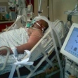 <p>[7877] 8  Nasser Sabatin, who was shot and severely wounded by soldiers while trying to cross the separation barrier to work inside Israel, in the intensive care unit of Beilinson Hospital.</p><p>Photo credit: Sarit Michaeli, B'Tselem</p>