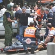 <p>[7524] 17  Israeli medical personnel help wounded civilians following a suicide attack at Tel Aviv's old central bus station, 17 April 2006.</p><p>Photo credit: Gil Cohen Magen, © Reuters</p>