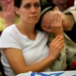 <p>[7577] 15  Mourners sitting alongside the Israeli flag-covered coffin of Daniel Wultz, who died of injuries he sustained in a suicide bombing in Tel Aviv [??put in date??], during a memorial service in Jerusalem.</p><p>Photo credit: Yonathan Weitzman, © Reuters</p>