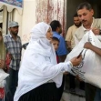 <p>[8642] 5  A Palestinian woman receives humanitarian aid at a United Nations food distribution center in the Khan Yunis refugee camp, in the Gaza Strip.</p><p>Photo credit: Ibraheem Abu Mustafa, © Reuters</p>