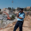 <p>[8582] 24  Policeman guarding the ruins of the Zahaikah family home, in the Jabal Mukaber neighborhood of East Jerusalem. The house was demolished by Israeli authorities on the grounds that it was built without a permit.</p><p>Photo credit: Kareem Jubran, B'Tselem</p>