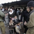<p>[9971] 1  A soldier checks the identity card of Palestinians at Huwara checkpoint near Nablus</p><p>Photo credit: Loay Abu Haykel, © Reuters</p>