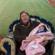 <p>[9316] 20  Ne'meh Muhammad Helmiyeh and her granddaughter, who was born at the Ras Kubsa checkpoint after Border Police officers prevented the mother from crossing to give birth in a hospital, 12 March 2007.</p><p>Photo credit: Kareem Jubran, B'Tselem</p>