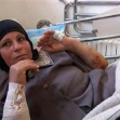 <p>[8396] 22  Yusra Sbeih, 64, resident of al-'Ubeidiyah, Bethlehem District, was assaulted and severely bitten by a dog accompanying soldiers during a search of the area. Soldiers took no action to remove the dog.</p><p>Photo credit: Suha Zeid, B'Tselem</p>