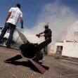 <p>[8638] 19  An Israeli police officer extinguishes a car that went up in flames after a Qassam rocket attack in city of Sderot, southern Israel.</p><p>Photo credit: Amir Cohen, © Reuters</p>