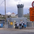 <p>[9236] 1  Children from the village of Nu'man, near Jerusalem, against the background of the checkpoint they have to cross daily on their way to and from school. Photo: Kareem Jubran, B'Tselem, 12 February 2008.</p><p>Photo credit: Kareem Jubran, B'Tselem</p>