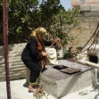<p>[9856] 24  Khitmeh Is'ed, aresident of Safarin Village in Tulkarm District, drawing water from a well in her yard. The village is not connected to a water system, and the residents suffer from severe water shortage.</p><p>Photo credit: Abd el-Karim a-Sadi, B'Tselem</p>