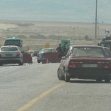 <p>[9753] 8  Almog/Beit Ha'arava Checkpoint. The photo, taken several days after the army announced the checkpoint had been removed, shows a Palestinian vehicle detained by the wayside while Israeli cars pass through the checkpoint. Photo: Firas 'Alami, ACRI.</p><p>Photo credit: Firas Alami, ACRI</p>