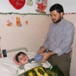 <p>[10183] 3  Ahmad a-Sweisi, seen here with with his paralyzed son Yasser, told B'Tselem how being cut off from electricity affected their lives.</p><p>Photo credit: Muhammad Sabah, B'Tselem</p>