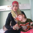 <p>[10322] 8  Operation Cast Lead: Maysaa a-Samuni, here with her infant daughter, gave testimony on the killing and wounding of members of her family, 4 January 2009. </p><p>Photo credit: Muhammad Sabah, B'Tselem</p>