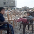 <p>[10377] 19  Operation Cast Lead: Due to shelling, the Shatiwi family was holed up in their home for 12 days. After they left, the army demolished the house, January 2009. Family members are seen next to the ruins of the family home.</p><p>Photo credit: Khaled 'Azayzeh, B'Tselem</p>