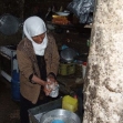 <p>[10665] 23  Maryam Daraghmeh, from Kh. al-Malah, washing utensils in a tub. Due to a lack of infrastructure and the water shortage, her family has no running water, March 2009.  </p><p>Photo credit: Atef Abu A-Rob, B'Tselem</p>