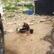 <p>[10667] 23  Nadira Daraghmeh, from Kh. al-Malah, washing clothes in a tub. Due to a lack of infrastructure and the water shortage, her family has no running water. (March 2009)  </p><p>Photo credit: Atef Abu A-Rob, B'Tselem</p>