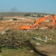 <p>[452] 1  A bulldozer digging a giant trench for the Separation Barrier in Jan. 2003.</p><p>Photo credit: Yehezkel Lein, B'Tselem</p>