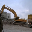 <p>[6] 11  The demolition of a building the IDF claimed was used as cover by Palestinian snipers who shot and killed a soldier on March 10, 2003.</p><p>Photo credit: Abby Okrent</p>