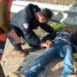 <p>[2840] 28  Nazmi a-Sheikh, beaten by soldiers at the Sarra checkpoint, receiving medical assistance from the Red Crescent on December 28, 2003.</p><p>Photo credit: Eliezer Moav, B'Tselem</p>