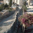 <p>[821] 21  The temporary separation wall in Abu Dis in East Jerusalem, prior to erection of the full eight-meter high wall.</p><p>Photo credit: Yehezkel Lein, B'Tselem</p>