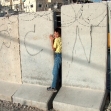 <p>[825] 21  A boy squeezes through a section of the temporary separation wall in Abu Dis on which the abbreviation for Border Police is graffitied.  The temporary wall has since been replaced by eight-meter high concrete slabs.</p><p>Photo credit: Yehezkel Lein, B'Tselem</p>