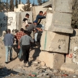 <p>[826] 21  Palestinians climb over the temporary separation wall in Abu Dis, which has since been replaced by the eight-meter high concrete slabs of the Separation Barrier.</p><p>Photo credit: Yehezkel Lein, B'Tselem</p>
