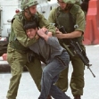 <p>[4857] 25  Israeli soldiers stranglehold a Palestinian boy in the West Bank town of Hebron.</p><p>Photo credit: Loay Abu Haykel, © Reuters</p>
