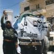 <p>[1863] 28  A resident of Yatta carrying a bucket she has filled with water from a tanker at a B'Tselem event protesting the water shortage in the West Bank. Yatta is one of the more than 150 Palestinian villages that are not connected to a water network.</p><p>Photo credit: Nisim Efergin</p>