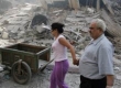 
Lebanese civilians evacuate from buildings destroyed during Israeli air strikes in southern Beirut, 21 July 2006. Photographer : STR New.